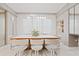 Bright dining room featuring modern lighting, white marble floors, and seating for six at 9845 Emerald Berry Dr, Winter Garden, FL 34787