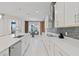 Bright, modern kitchen with stainless steel appliances and eat-in dining area at 9845 Emerald Berry Dr, Winter Garden, FL 34787