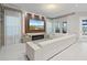 Bright and modern living room with a large TV, fireplace and comfortable seating at 9845 Emerald Berry Dr, Winter Garden, FL 34787