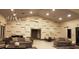 Modern lobby area with stylish sofas, contemporary lighting, and elegant decor for a welcoming atmosphere at 9845 Emerald Berry Dr, Winter Garden, FL 34787