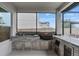 An outdoor kitchen with stainless steel grill, sink and serving area at 9845 Emerald Berry Dr, Winter Garden, FL 34787