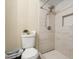 Bathroom featuring tiled shower with niche, modern fixtures, and convenient toilet placement at 1031 S Hiawassee Rd # 2517, Orlando, FL 32835
