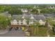 Aerial view of a residential apartment building with palm trees and on-site parking at 1031 S Hiawassee Rd # 2517, Orlando, FL 32835