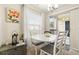 Charming dining area with white table set, bright natural light, and sliding glass door access at 1031 S Hiawassee Rd # 2517, Orlando, FL 32835