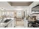 Spacious open layout showcasing kitchen with stainless appliances and a connecting dining and living area at 1031 S Hiawassee Rd # 2517, Orlando, FL 32835