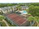 A full tennis court is shown amongst the community of a multi-Gathering residential property at 1031 S Hiawassee Rd # 2517, Orlando, FL 32835