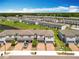 Aerial view showcases the neighborhood layout with tree-lined streets, green spaces and convenient parking at 1045 Desert Candle Dr, Ocoee, FL 34761