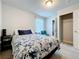 Relaxing bedroom with neutral carpet, a floral bedspread, and ensuite bathroom access at 1045 Desert Candle Dr, Ocoee, FL 34761
