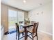 Dining room featuring a wooden table with seating and a view of the outdoor patio at 1045 Desert Candle Dr, Ocoee, FL 34761