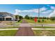 A crosswalk and a stop sign are found in a new neighborhood, ensuring the safety of pedestrians and drivers alike at 1045 Desert Candle Dr, Ocoee, FL 34761