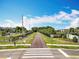 The entrance to the walking trails beckons outdoor enthusiasts to enjoy scenic strolls amidst lush greenery and serene surroundings at 1045 Desert Candle Dr, Ocoee, FL 34761