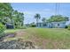 Large backyard with healthy green lawn and partial view of home at 1120 Courtland St, Orlando, FL 32804