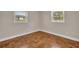 This bedroom features hardwood floors and two windows at 1120 Courtland St, Orlando, FL 32804