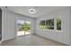 Open dining room features bright natural light, light wood floors, and sliding glass doors to the backyard at 1120 Courtland St, Orlando, FL 32804