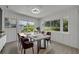 Bright dining room features modern lighting, light wood flooring, and sliding glass doors to the backyard at 1120 Courtland St, Orlando, FL 32804