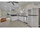 Bright kitchen with white cabinets, stainless steel appliances, and ample counter space at 1120 Courtland St, Orlando, FL 32804