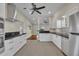 Spacious kitchen with white cabinets, stainless steel appliances, and open layout at 1120 Courtland St, Orlando, FL 32804