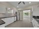 Modern kitchen boasts white cabinets, black countertops, and stainless steel appliances at 1120 Courtland St, Orlando, FL 32804