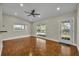 Inviting living room with hardwood floors, vaulted ceilings, and access to the outdoors at 1120 Courtland St, Orlando, FL 32804