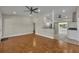 Open-concept living area with hardwood floors and seamless flow to the modern kitchen at 1120 Courtland St, Orlando, FL 32804