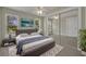 This bedroom features neutral colors, hardwood floors, and large closets with sliding mirror doors at 1120 Courtland St, Orlando, FL 32804