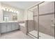 Spa-like bathroom with a separate glass shower, soaking tub, and double vanity at 11258 Whistling Pine Way, Orlando, FL 32832