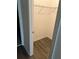 Walk-in closet featuring laminate flooring and shelving for optimal storage at 11258 Whistling Pine Way, Orlando, FL 32832