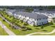 Aerial shot of neighborhood with homes, landscaping, and sign at 11258 Whistling Pine Way, Orlando, FL 32832