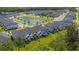 Aerial view of homes with landscaping, a pond, and lots of parking at 11258 Whistling Pine Way, Orlando, FL 32832