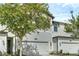 Charming townhome with a well-maintained front yard and an attached garage at 11258 Whistling Pine Way, Orlando, FL 32832