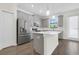 Well-lit kitchen with modern appliances, white countertops, and ample cabinet space at 11258 Whistling Pine Way, Orlando, FL 32832