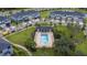 Aerial view of neighborhood pool and clubhouse with lounge seating at 11258 Whistling Pine Way, Orlando, FL 32832