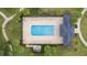 Aerial view of the community pool features lots of chairs and landscaping at 11258 Whistling Pine Way, Orlando, FL 32832