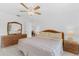 Bedroom with light colored walls, tile flooring, and light wood furnishings at 1156 Lucaya Cir, Orlando, FL 32824