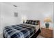 Bedroom featuring tiled floors, light colored walls, and two side tables at 1156 Lucaya Cir, Orlando, FL 32824