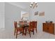 Cozy dining area with wood furniture and easy access to kitchen at 1156 Lucaya Cir, Orlando, FL 32824