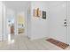 Bright foyer featuring tiled floors and a clear view into the bedroom at 1156 Lucaya Cir, Orlando, FL 32824