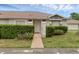 Charming single-story home featuring a well-maintained lawn and tiled walkway at 1156 Lucaya Cir, Orlando, FL 32824