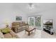 Inviting living room with a sliding door leading to the outdoors at 1156 Lucaya Cir, Orlando, FL 32824