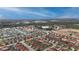 Extensive aerial view of a planned community featuring red tile roofs and pristine landscaping at 117 Rosso Dr, Davenport, FL 33837