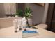 Bathroom features complimentary Mikado toiletries, vanity mirror, and stylish decor at 117 Rosso Dr, Davenport, FL 33837