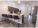Contemporary kitchen featuring an island with bar seating, stainless appliances, and ample cabinet space at 117 Rosso Dr, Davenport, FL 33837