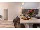 Stylish kitchen featuring an island with bar stools, modern appliances, and an open layout perfect for entertaining at 117 Rosso Dr, Davenport, FL 33837