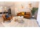 Bright living room with modern furnishings, decor, and a neutral color scheme at 117 Rosso Dr, Davenport, FL 33837