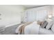 Bright bedroom with a large closet and neutral decor featuring carpet floors and contemporary design at 12929 Louisiana Woods Ct, Orlando, FL 32824