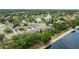 Neighborhood situated on a lake with mature landscaping and lush green lawns at 12952 Downstream Cir, Orlando, FL 32828