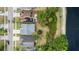 Aerial view of homes with a lake, showcasing a neighborhood with mature landscaping and waterfront properties at 12952 Downstream Cir, Orlando, FL 32828