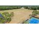 Aerial view of the athletic field and tennis court maintained by the HOA or community at 12952 Downstream Cir, Orlando, FL 32828