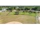 Well-kept baseball field next to a playground and lake in a residential neighborhood at 12952 Downstream Cir, Orlando, FL 32828