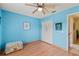 Light-filled bedroom with wood floors and a closet, offering a serene and organized living space at 12952 Downstream Cir, Orlando, FL 32828